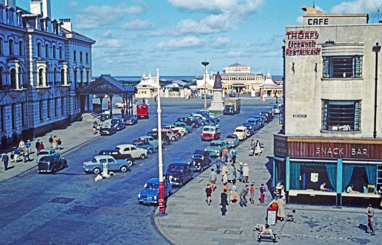 The infilling of the route to the beach allowed the building of a new pavilion at the top of Nevill Street, to the right of the pier entrance. By the 1950s it had become the Casino. Thorp's Restaurant's Art Deco frontage contrasts with the Victoria Hotel opposite. | The Atkinson, Southport